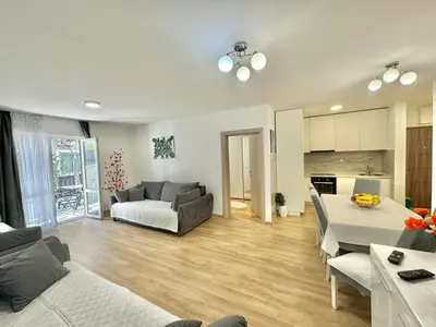 a living room with a couch and a table at Family One bedroom apartment Marijana in Budva