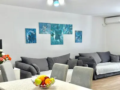 a living room with a couch and a table at Family One bedroom apartment Marijana in Budva