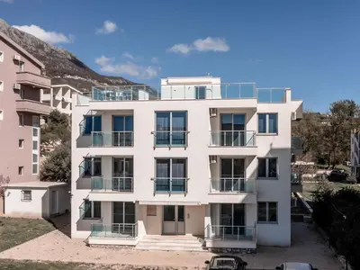 an apartment building with balconies on it at Apartments 4U in Dobra Voda