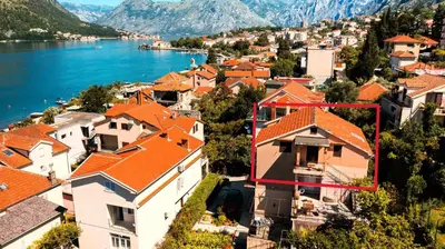 an aerial view of a town with orange roofs at Apartment Busola in Kotor
