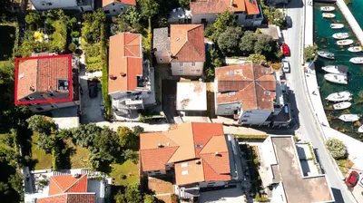 an overhead view of a house with orange roofs at Apartment Busola in Kotor