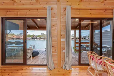 a porch with windows and a view of the water at Bel Assis in Ulcinj