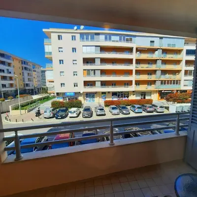 a balcony with a view of a parking lot at Studio apartment Vito in Podgorica