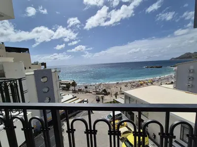 a view of the beach from a balcony at Skyline Apartments in Dobra Voda