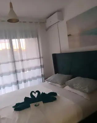 a bedroom with a bed with a heart decoration on it at Oceans Apartman in Dobra Voda