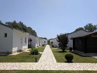 a walkway leading to a row of houses at Beni Bungalows in Ulcinj
