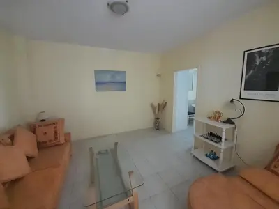 a living room with a couch and a table at Beach edge 4-Bed House in Muo Kotor in Kotor