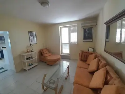 a living room with a couch and a chair at Beach edge 4-Bed House in Muo Kotor in Kotor