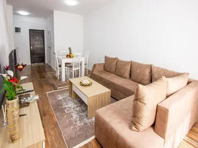 a living room with a couch and a table at Apartment Ochsen in Ulcinj