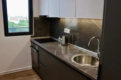 a kitchen with a sink and a counter top at Villa Cataleya in Ulcinj