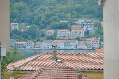 a view of a town with houses and water at Majestic Suite,800m to Old town&minutes to seaside in Kotor