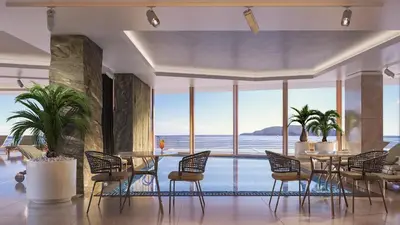 a dining room with a view of the ocean at Hotel Ponta Plaza Conference & Spa in Budva