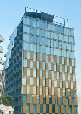 a tall glass building with a lot of windows at Hotel Ponta Plaza Conference & Spa in Budva
