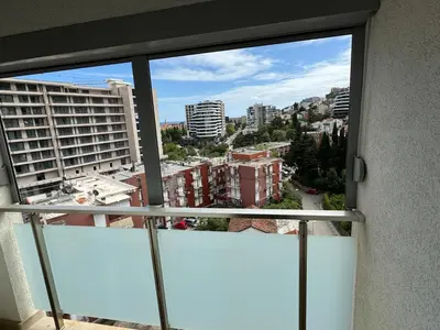 a view of a city from a window at City center lux 2bdr apt with garage in Budva