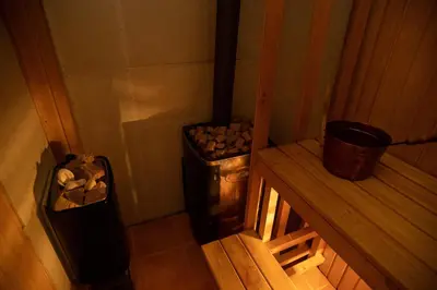 a small room with a stove and a trash can at Villa Sea La vie in Utjeha