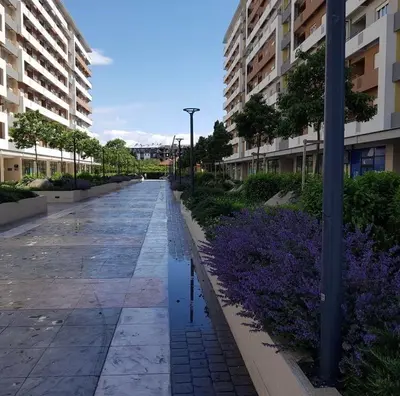 an empty street in a city with buildings at Studio apartman Vivo Central in Podgorica