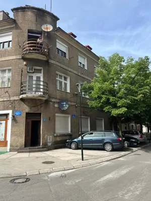 a blue car parked in front of a building at Old Capital in Cetinje