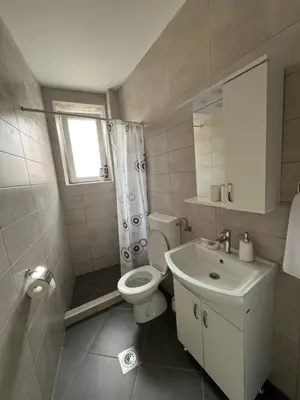 a bathroom with a toilet and a sink at Old Capital in Cetinje