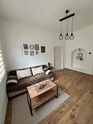 a living room with a couch and a coffee table at Old Capital in Cetinje