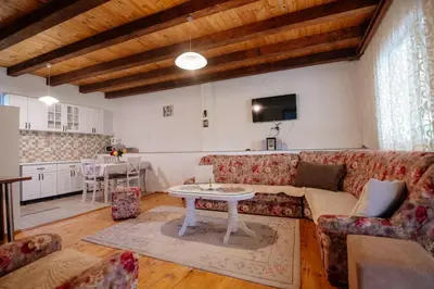 a living room with a couch and a table at Omni S Apartments in Bar