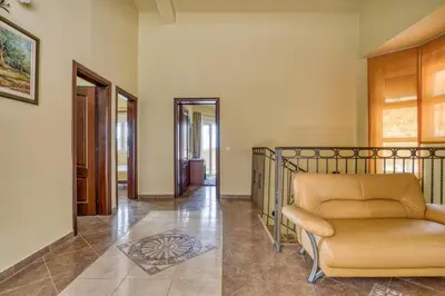 a living room with a couch and a hallway at The view villa in Petrovac na Moru
