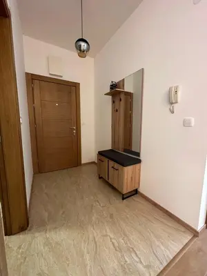 a room with a mirror and a wooden door at Apartman Diplomat in Budva