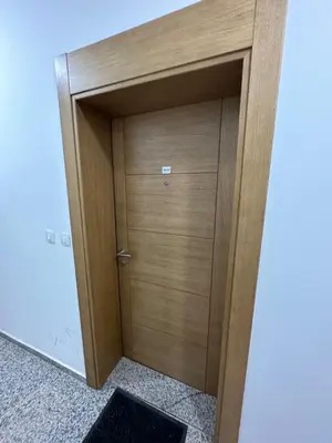 a wooden door in the corner of a room at Apartman Diplomat in Budva