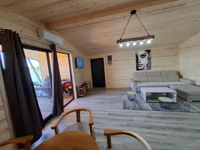 a living room with a couch and a table at Ada Bojana kucica Una in Ulcinj