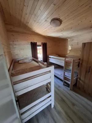 a room with two bunk beds in a cabin at Ada Bojana kucica Una in Ulcinj