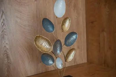 a bunch of blue and gold balloons in a vase at Cataleya Resort in Ulcinj