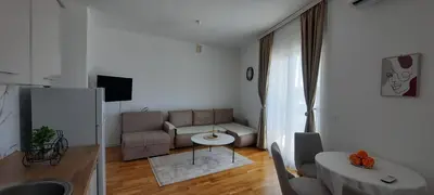 a living room with a couch and a table at Al Mare in Ulcinj