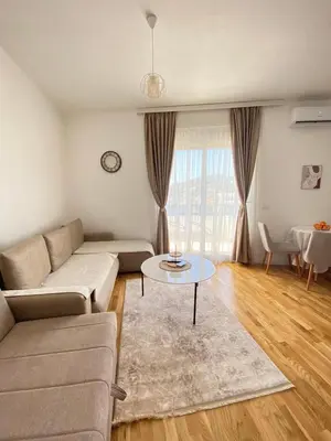 a living room with a couch and a table at Al Mare in Ulcinj