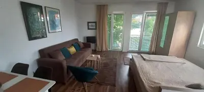 a living room with a couch and a table at Studio Nik in Cetinje
