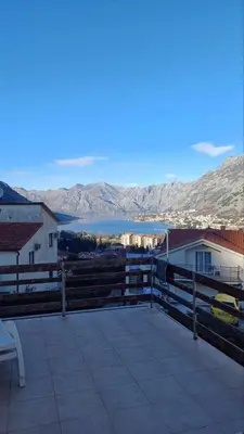 a patio with a view of a body of water at Vaso & Viktor Apartment in Kotor