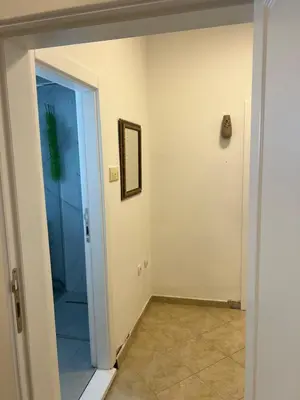 a hallway with a door leading into a room at Apartman Vučko in Rafailovici