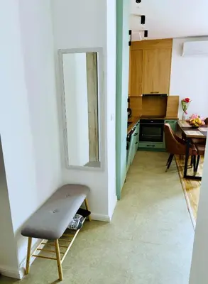 a kitchen with a table and a chair in a room at Nonna Marija in Kotor