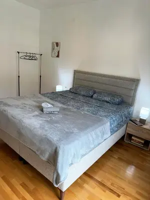 a bedroom with a large bed in a room at Nonna Marija in Kotor