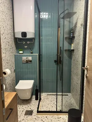 a bathroom with a glass shower with a toilet at Nonna Marija in Kotor