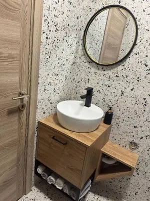 a bathroom with a sink and a mirror at Nonna Marija in Kotor