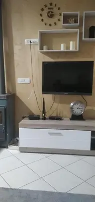a flat screen tv sitting on top of a table at Apartman,,Siv,, Prijevor in Budva