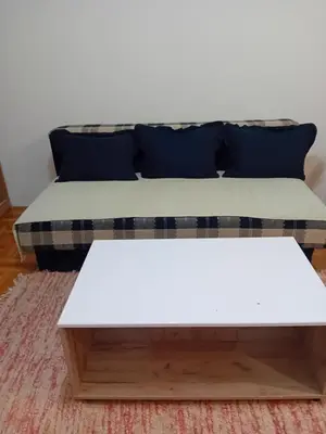 a white couch with a white coffee table at Apartman,,Siv,, Prijevor in Budva