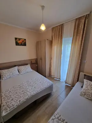 a bedroom with two beds and a window at DMD Apartments in Budva