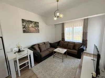 a living room with a couch and a table at Era Apartments in Ulcinj