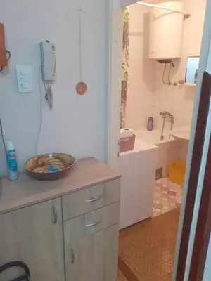 a bathroom with a sink and a toilet and a tub at Lamela in Bar