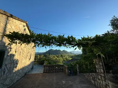 a hallway with a view of a mountain at NikolaS Family cottage in Cetinje