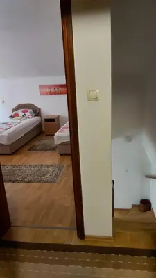 a room with a bedroom with a bed and a mirror at Engie Apartment in Budva