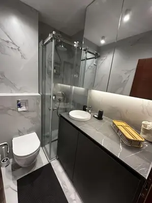 a bathroom with a toilet and a shower and a sink at Serenity Seaview Suite Przno in Pržno