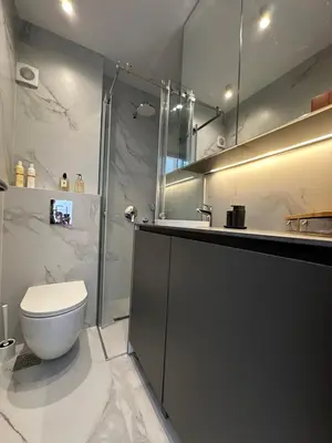 a bathroom with a toilet and a shower and a sink at Serenity Seaview Suite Przno in Pržno