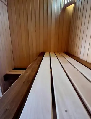 a wooden interior of a small cabin with wooden walls at Country home Dolac POOL&SAUNA in Bar