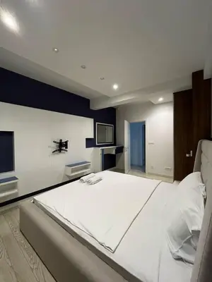 a large bedroom with a large white bed in it at Budva Gate by In Property in Budva